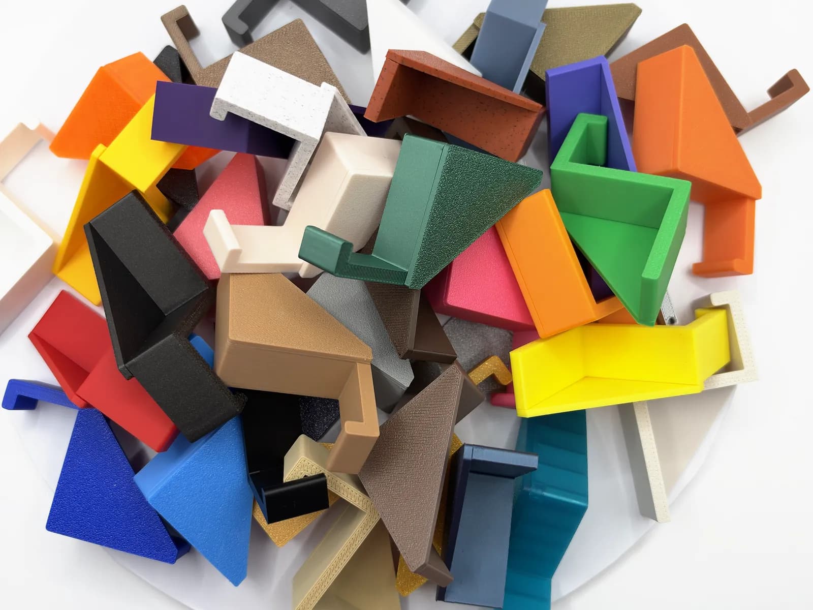 Headphone Hangers in about thirty single colours, seen from above